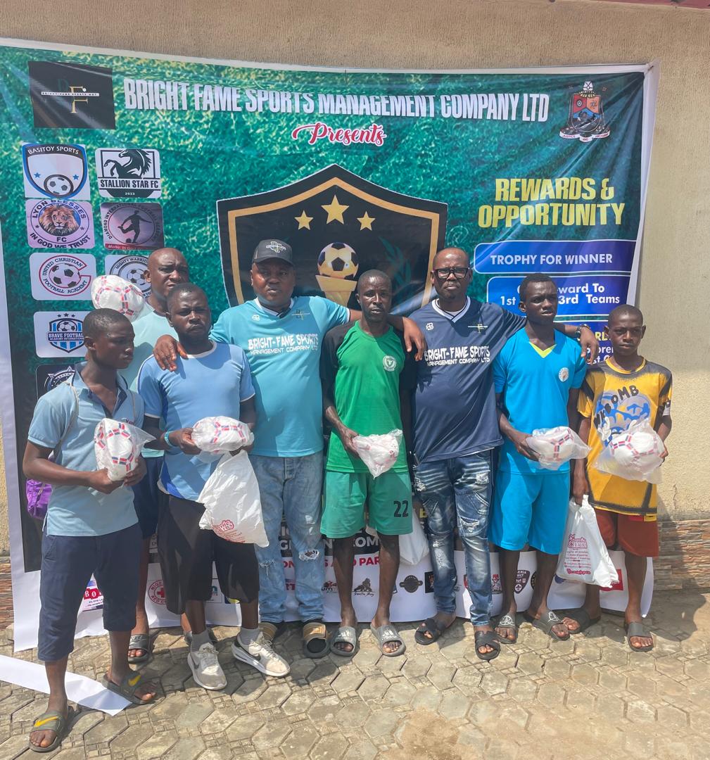Bright Fame Sports Management officials with young players at a football event