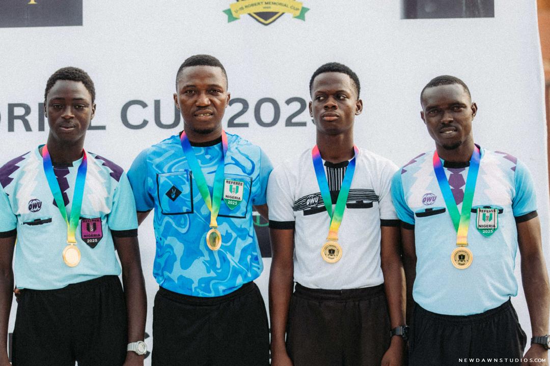 Match referees with medals at the tournament