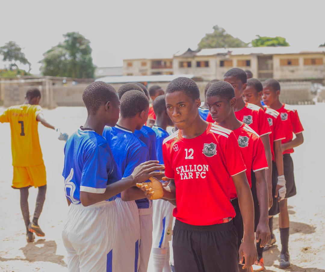 Stallion Stars FC players greeting the opposing team before kick-off